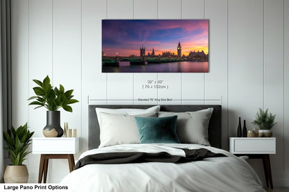 a bedroom scene with focus on the bed and the city skyline