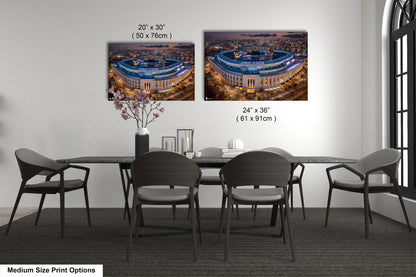 a dining room table with four chairs and a vase of flowers