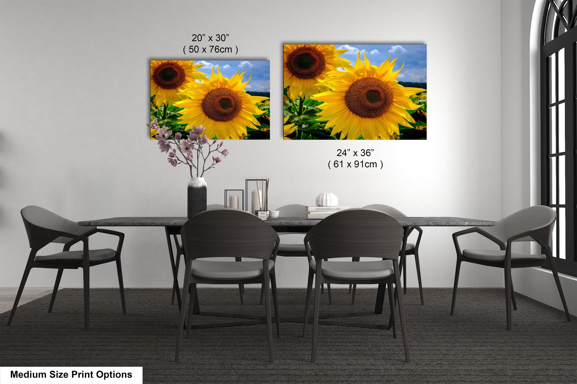 a dining room table with four chairs and a vase of sunflowers