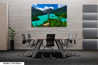 a modern office space with a large, vibrant landscape painting hanging on the wall above a wooden table surrounded by chairs.