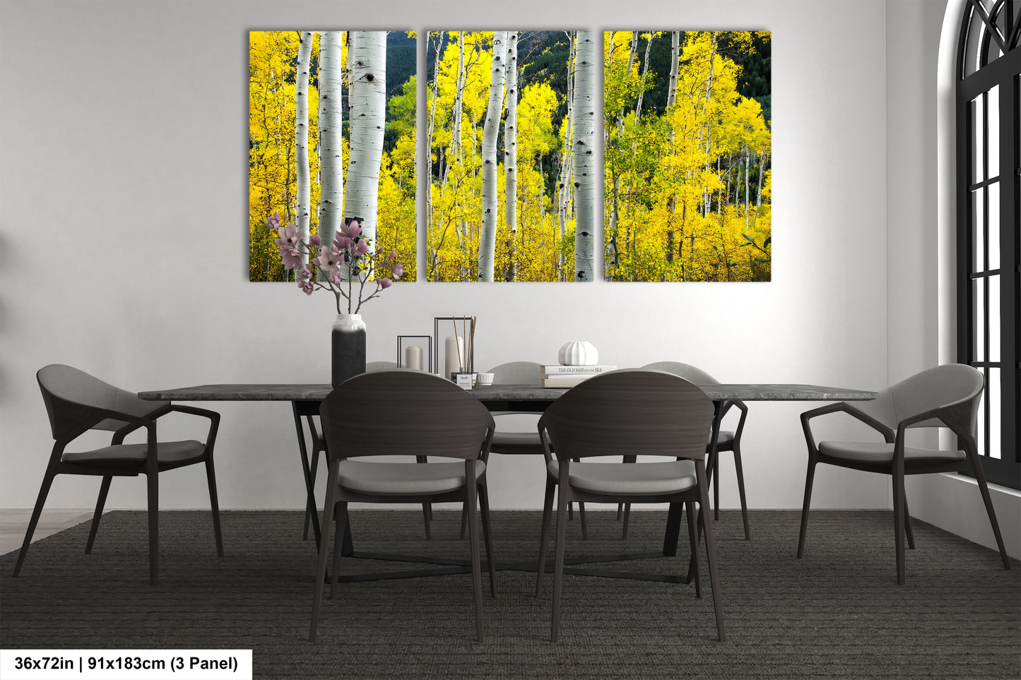 a dining room table with a vase of flowers on it
