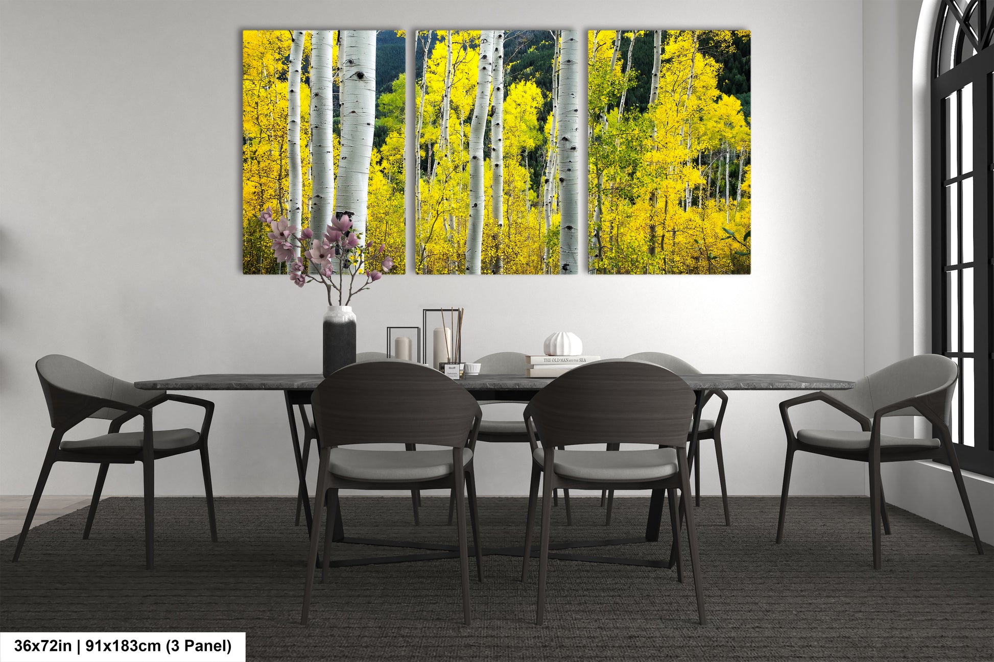 a dining room table with a vase of flowers on it
