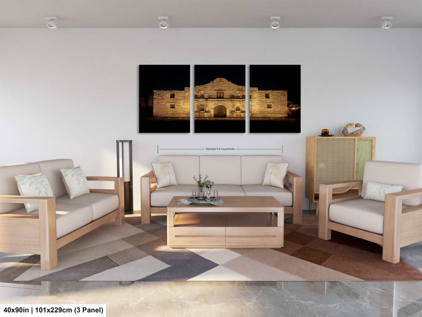 The image is a modern living room with a large, illuminated building in the background. The room is furnished with a sofa, two chairs, and a coffee table. The furniture appears to be made of wood and has a neutral color scheme. The room is well-lit, with natural light coming in from the windows. The overall design and layout of the room create a comfortable and inviting atmosphere.