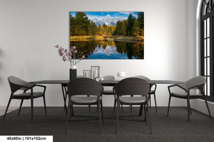 a dining room table with chairs and a painting on the wall