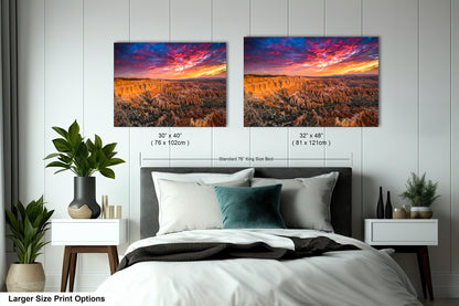 a bedroom with a bed and two pictures on the wall