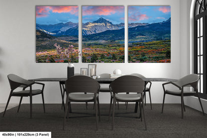 a dining room with a table and four chairs