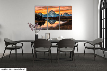 a dining room table with chairs and a painting on the wall