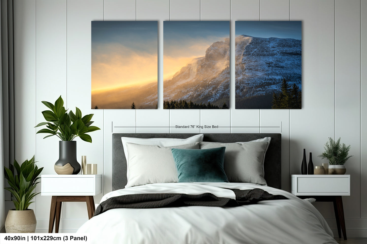 a bedroom with a bed and two paintings on the wall