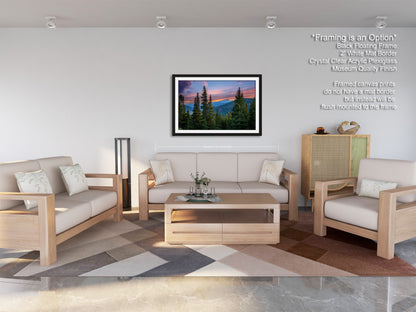a modern living room with a large framed landscape painting hanging on the wall. The room is furnished with a sofa, two armchairs, and a coffee table, creating a comfortable and inviting atmosphere.
