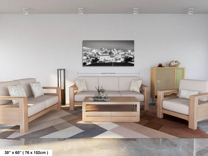 a living room filled with furniture and a painting on the wall