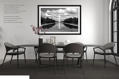 a black and white photo of a table and chairs