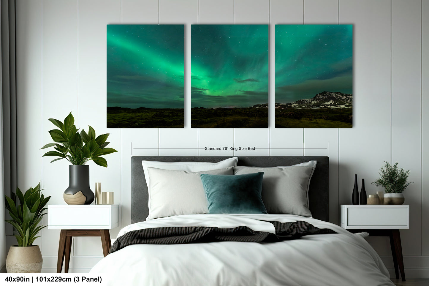 a bed room with a neatly made bed and three paintings on the wall