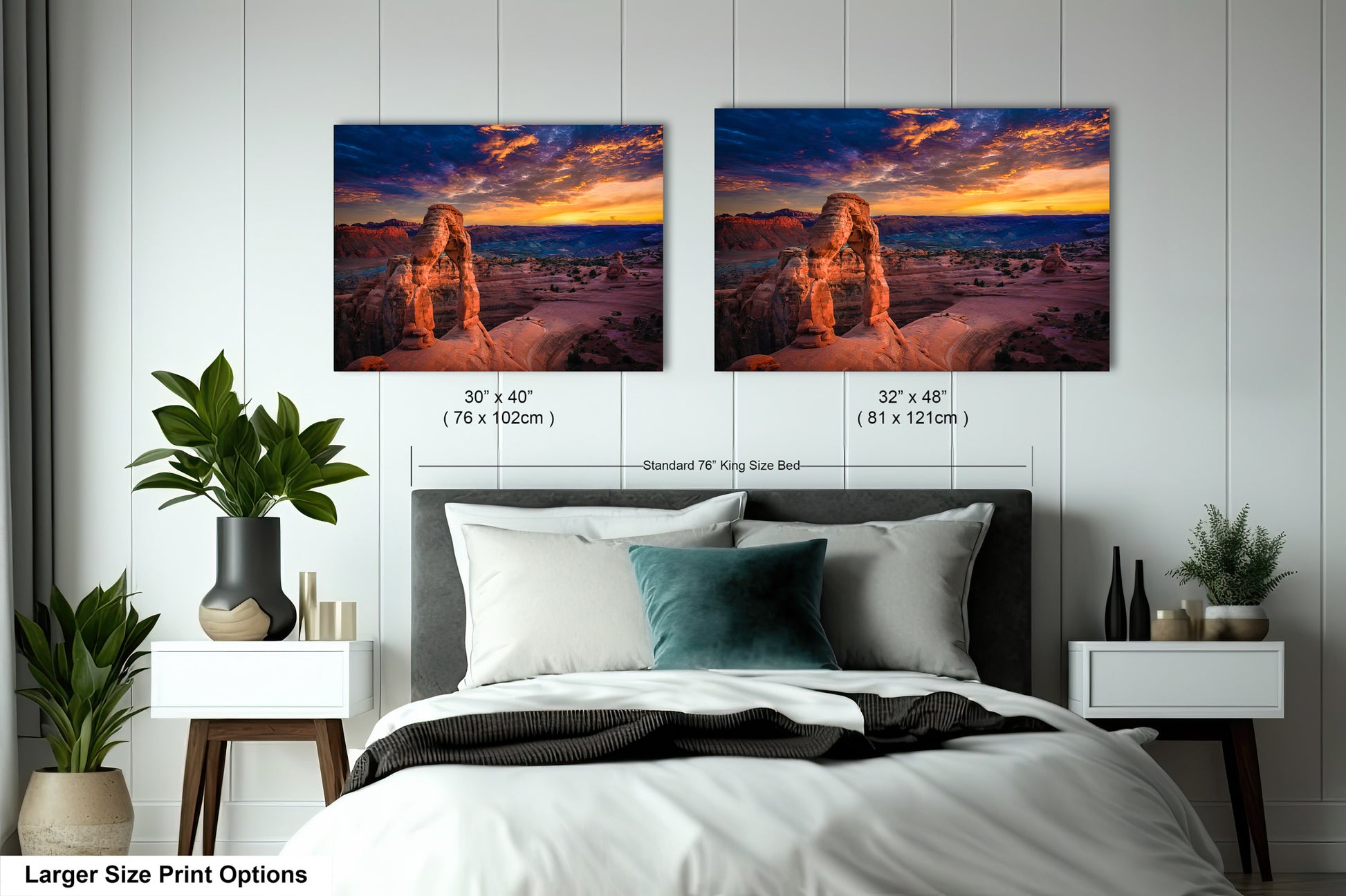 a bedroom with a bed and two pictures on the wall