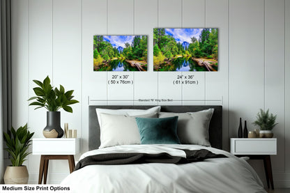 a bed room with a neatly made bed and two pictures on the wall