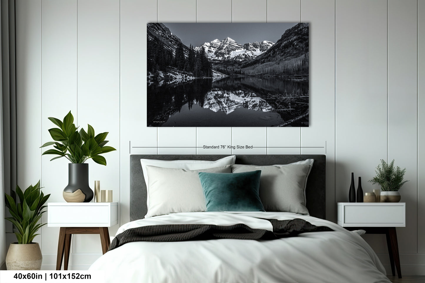 a black and white photo of a mountain lake