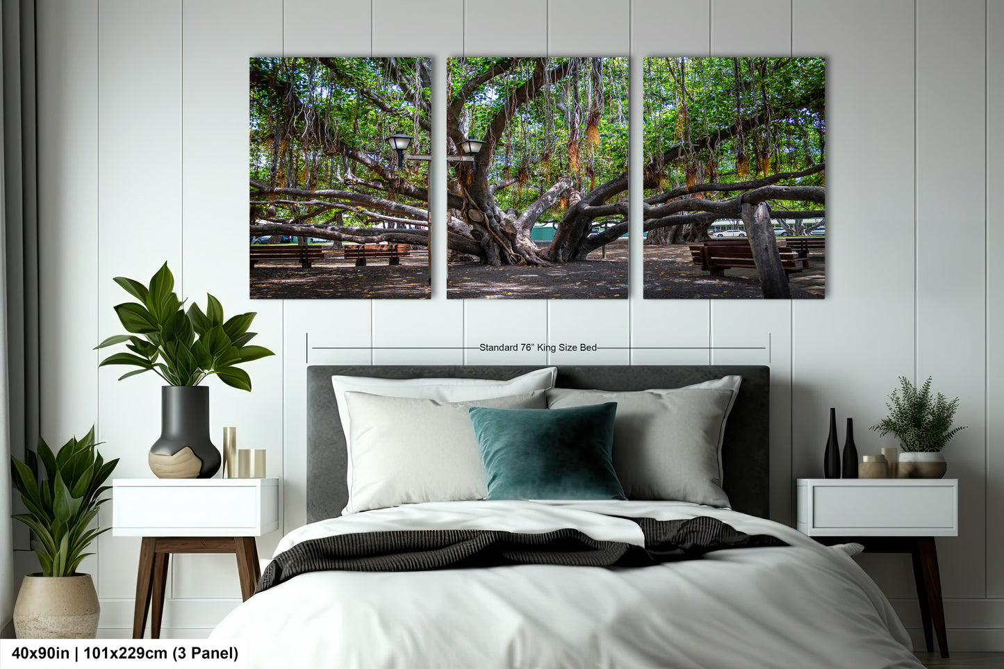 a bed room with a neatly made bed and two paintings on the wall