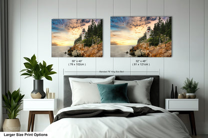 a bed with two pictures on the wall above it
