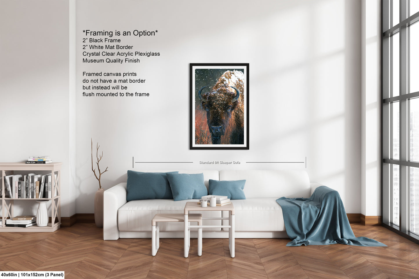 a living room with a white couch and a painting on the wall