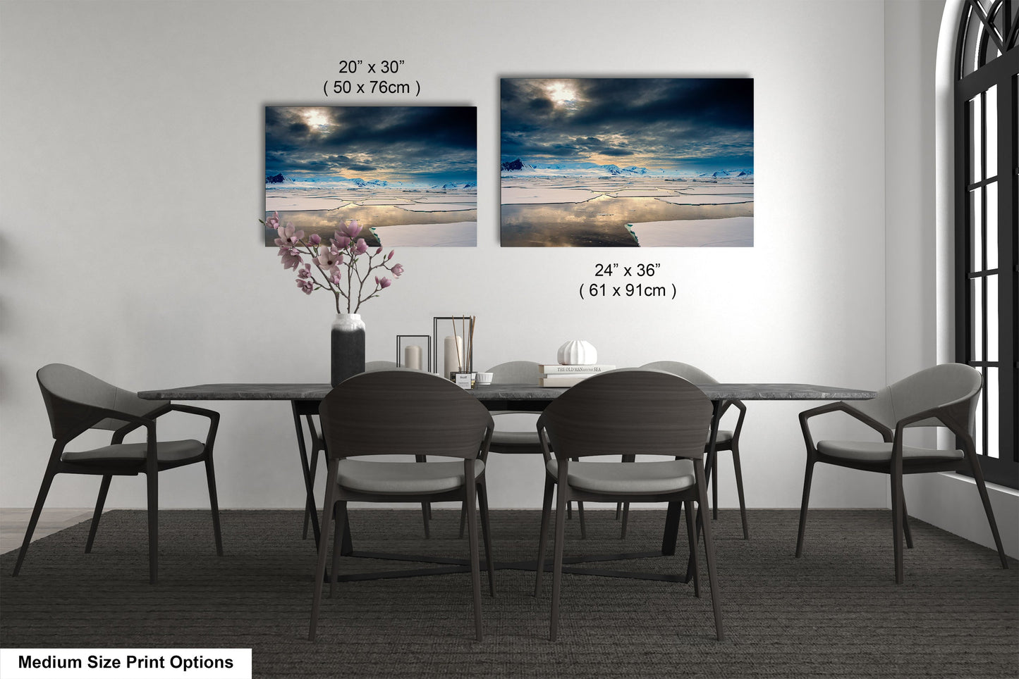 a dining room table with chairs and a vase of flowers