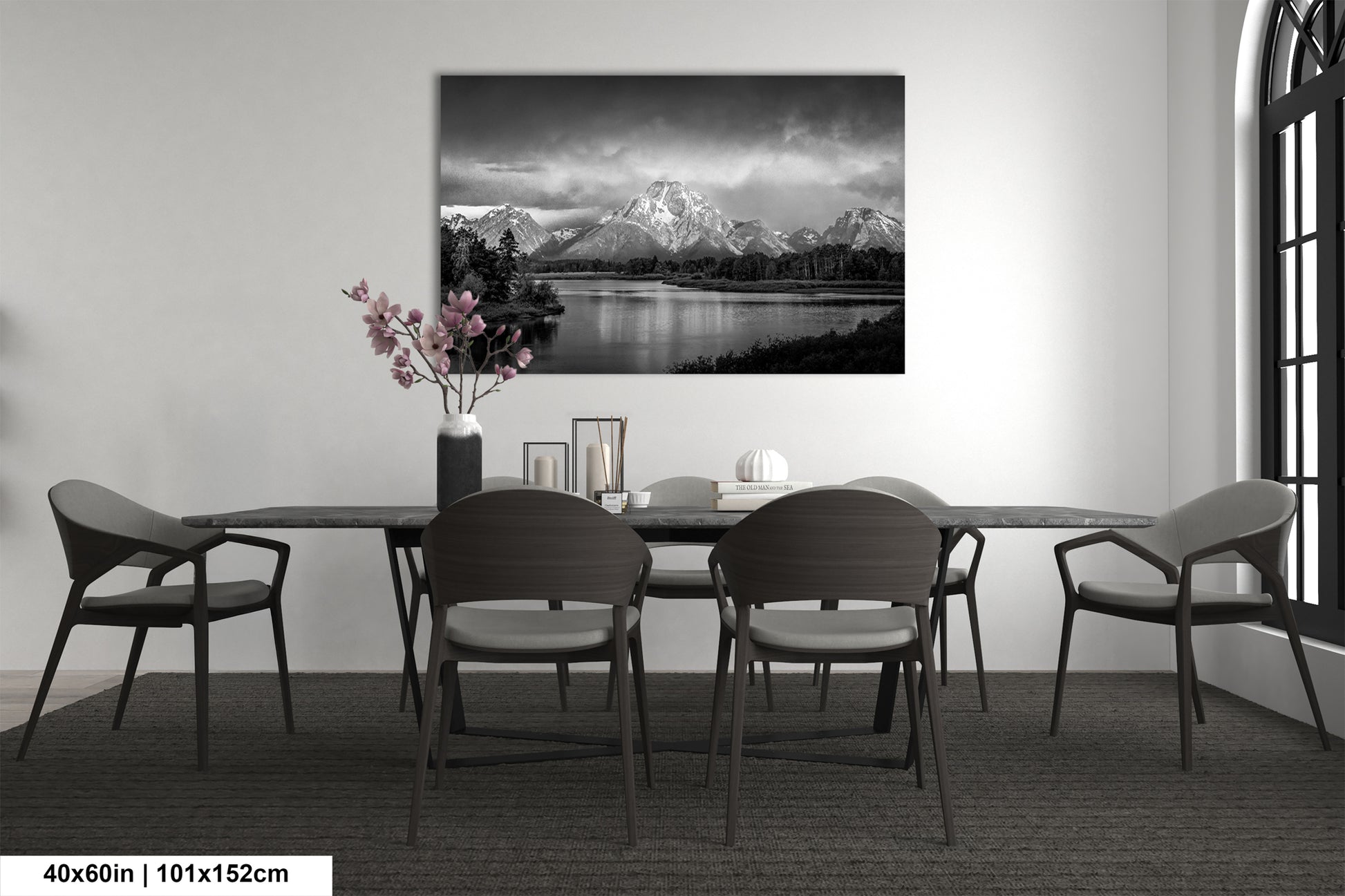 a black and white photo of a dining room table
