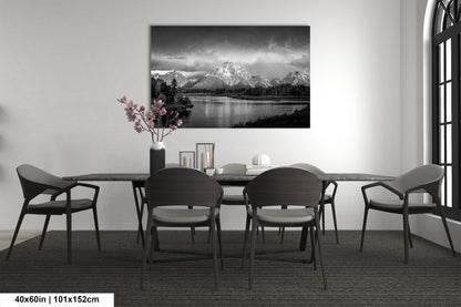 a black and white photo of a dining room table