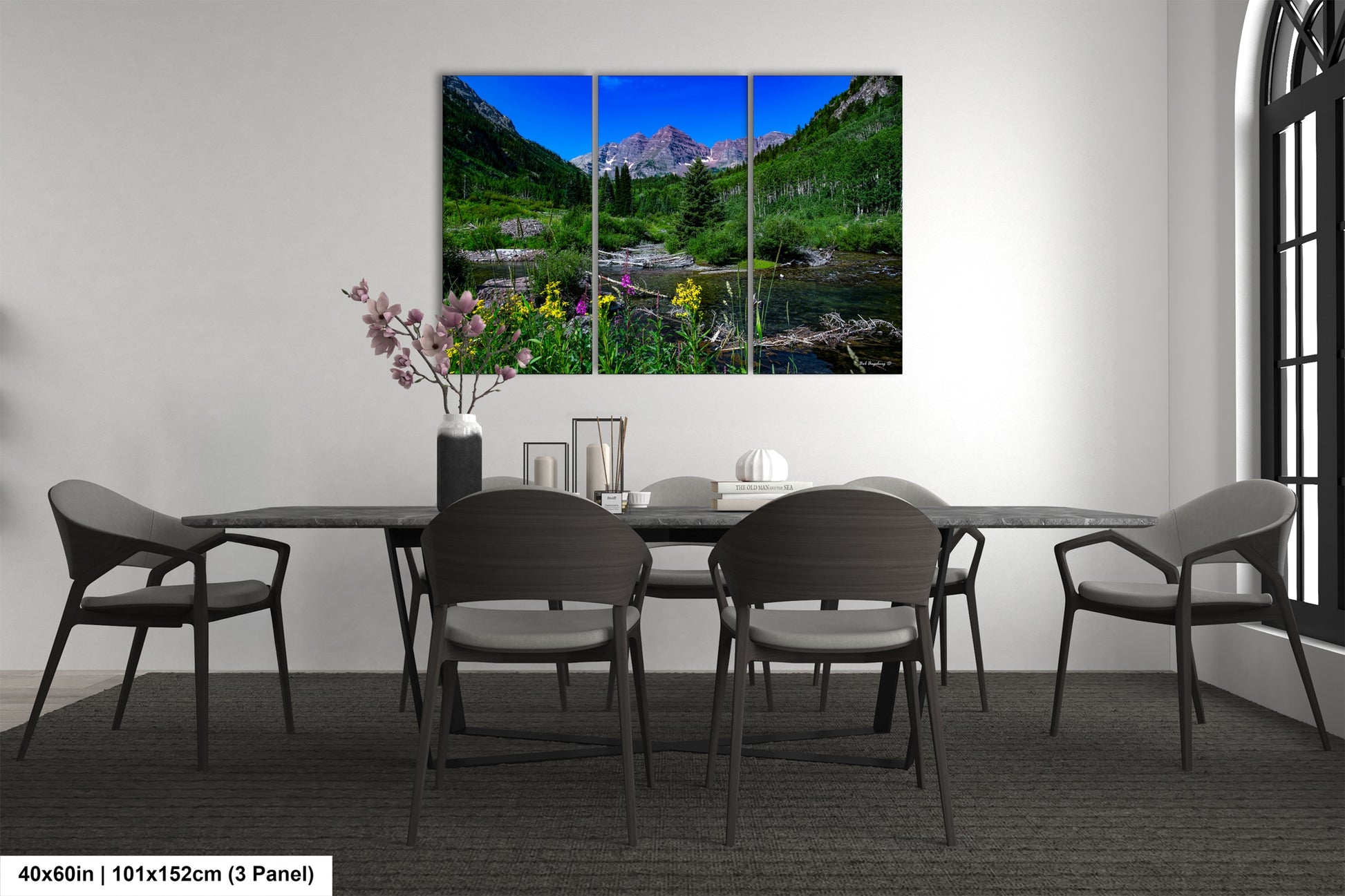 a dining room with a table and chairs