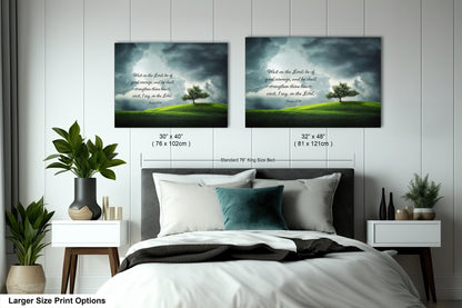 a bed with a white comforter and two pictures on the wall above it