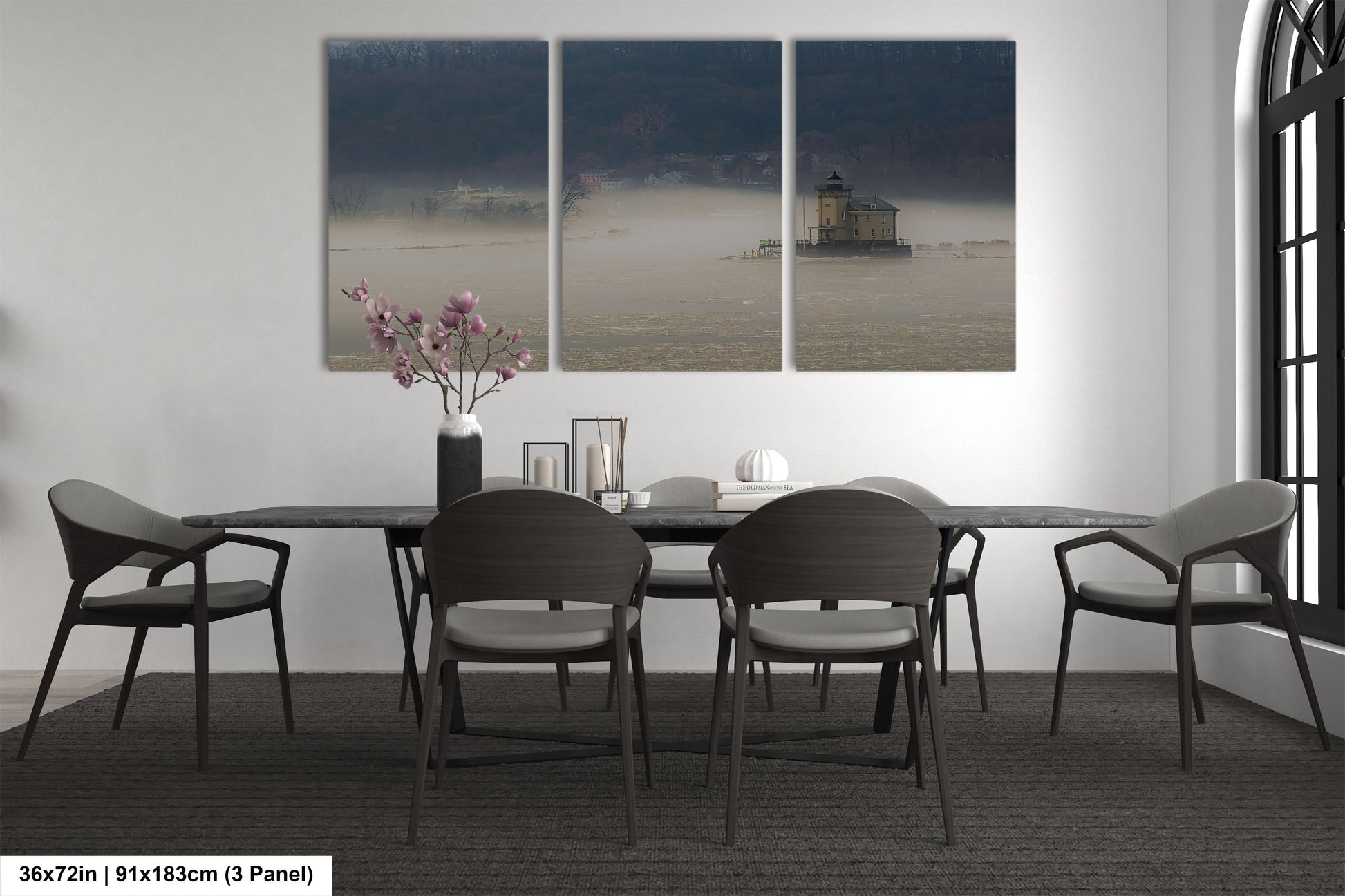 a dining room table with four chairs and a vase of flowers