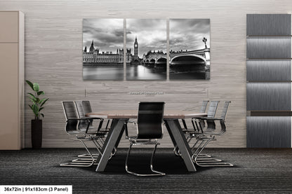 a black and white photo of a table and chairs