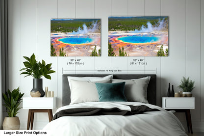 a bedroom with a large bed and two pictures on the wall