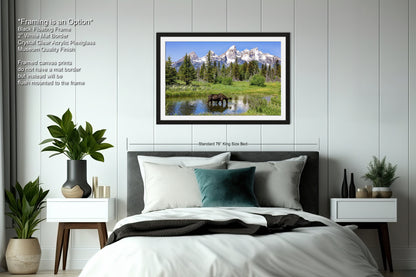 a bedroom with a bed and a picture hanging on the wall