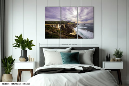 a bedroom scene with a bed and a large picture on the wall