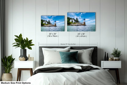 a bedroom with a bed and two pictures on the wall