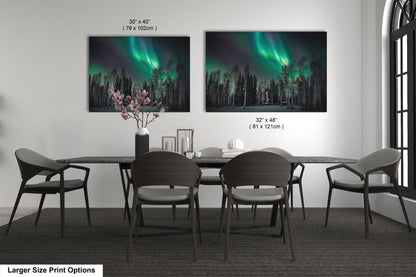 a dining table with four chairs and a vase with flowers