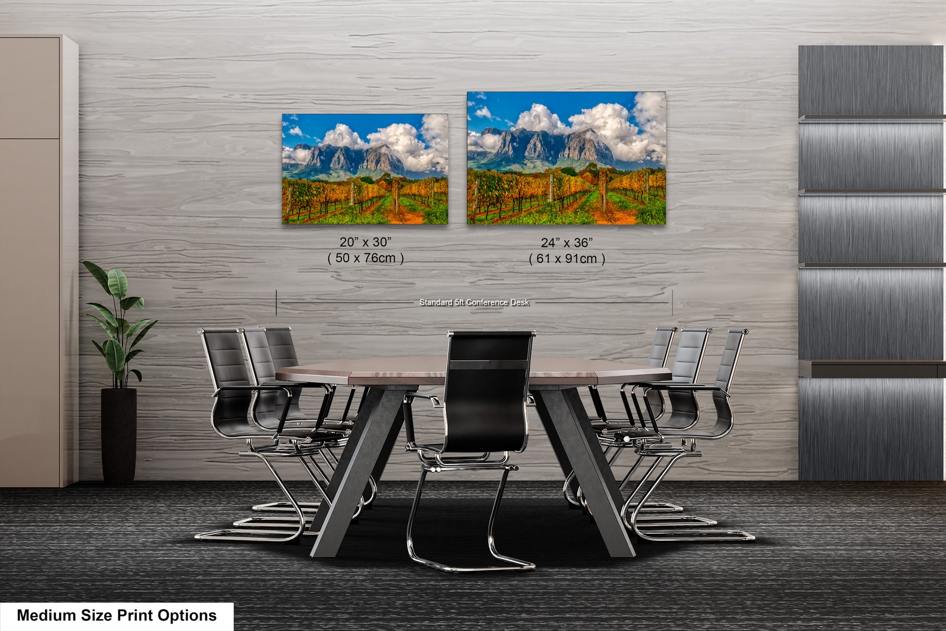 a dining room table with chairs and two pictures on the wall