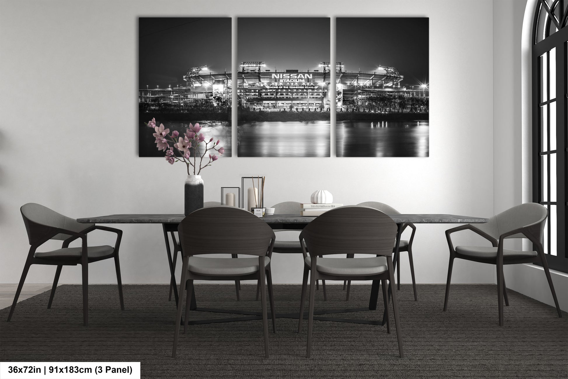 a black and white photo of a dining room table