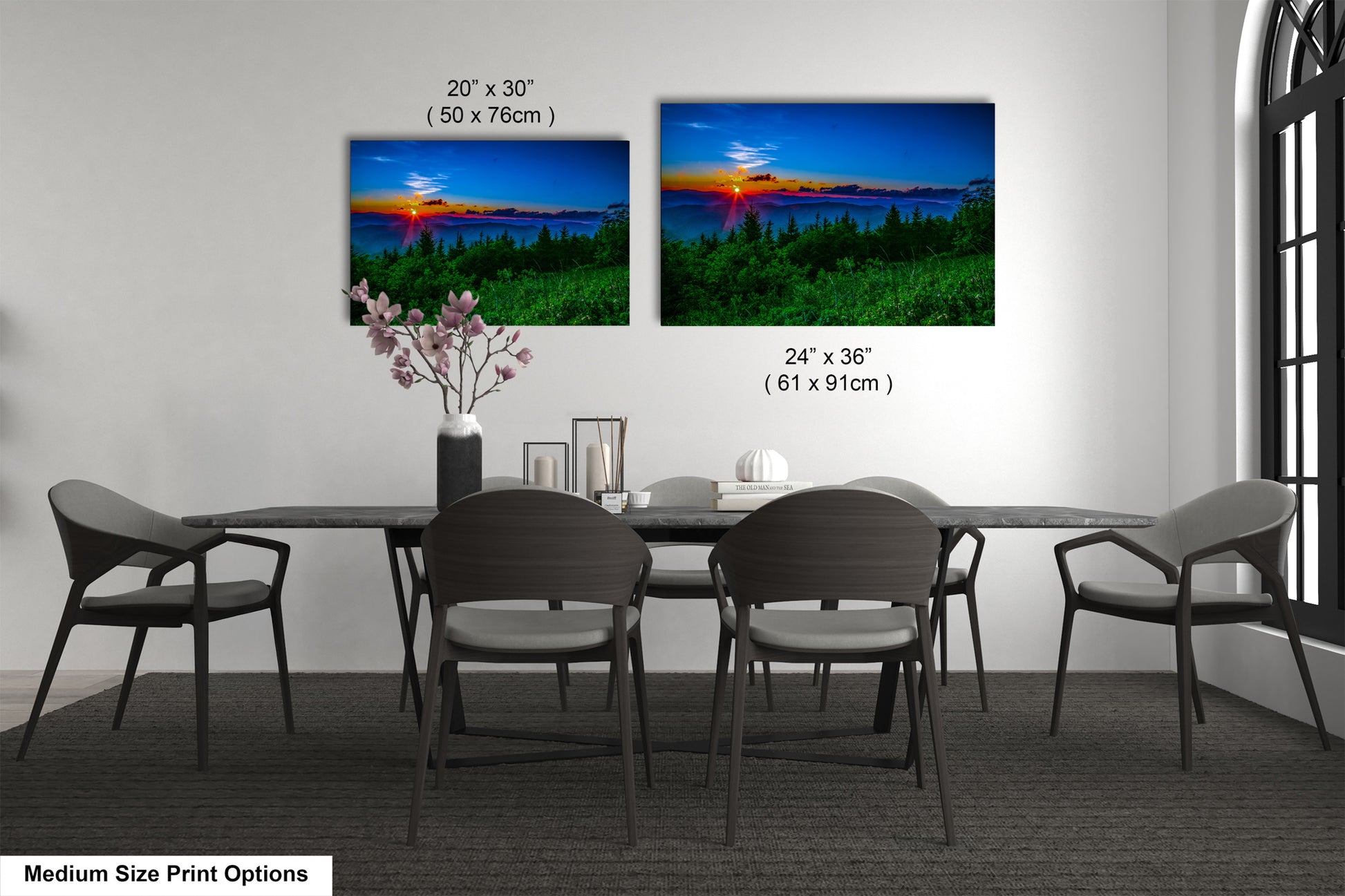 a dining table with four chairs and a vase of flowers