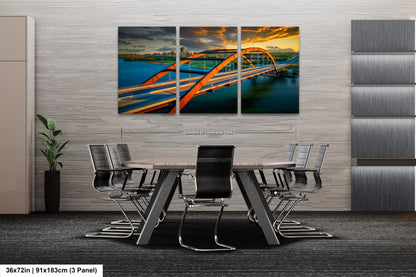 a dining room table with chairs and a painting on the wall