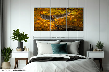 a bedroom scene with focus on the bed and the wall art