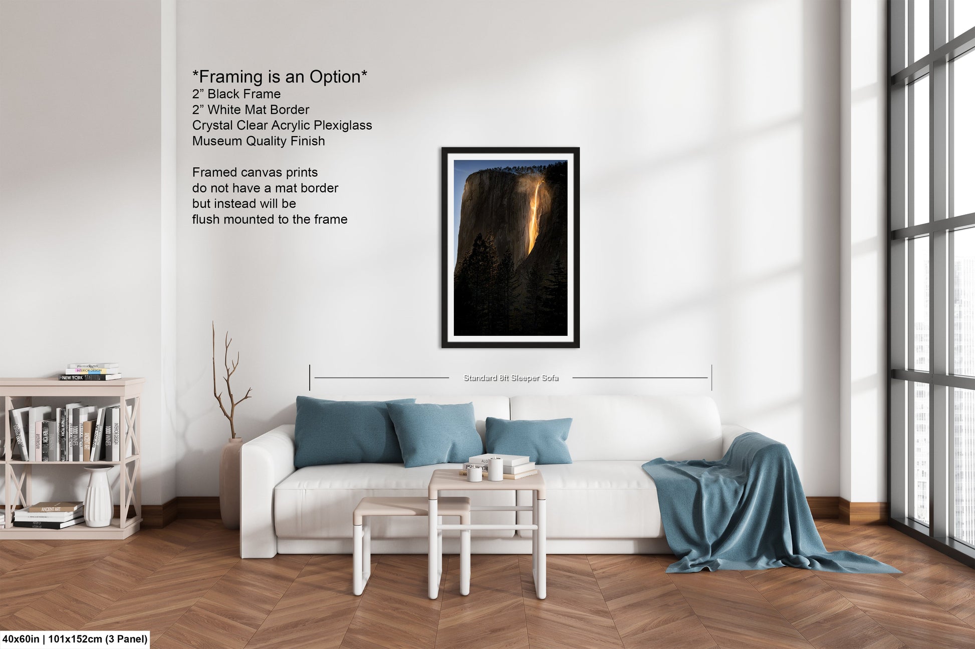 a living room with a white couch and a painting on the wall