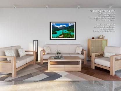 a modern living room with a large framed landscape painting hanging on the wall. The room is furnished with a sofa, two armchairs, and a coffee table, creating a comfortable and inviting atmosphere.