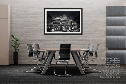 a black and white photo of a dining room table