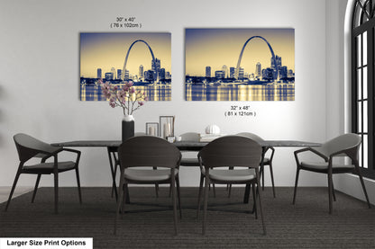 a dining room table with four chairs and a vase of flowers