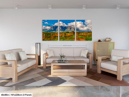a living room filled with furniture and a painting on the wall