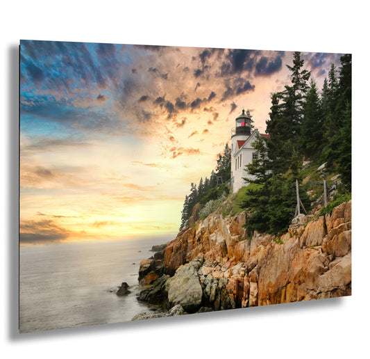 a picture of a lighthouse on a rocky cliff
