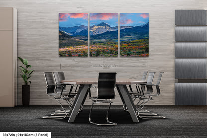 a dining room with a table and chairs