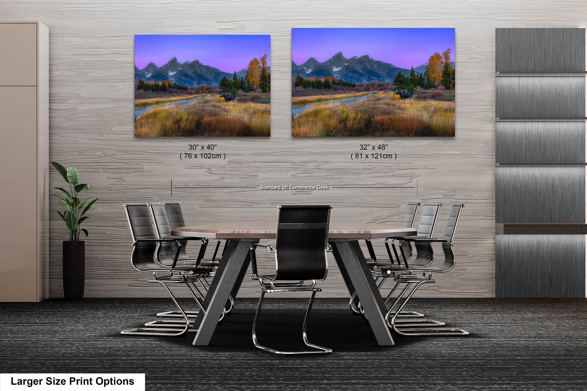 a dining room table with chairs in front of a wall with two pictures of mountains