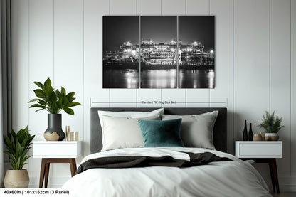 a black and white photo of a bedroom