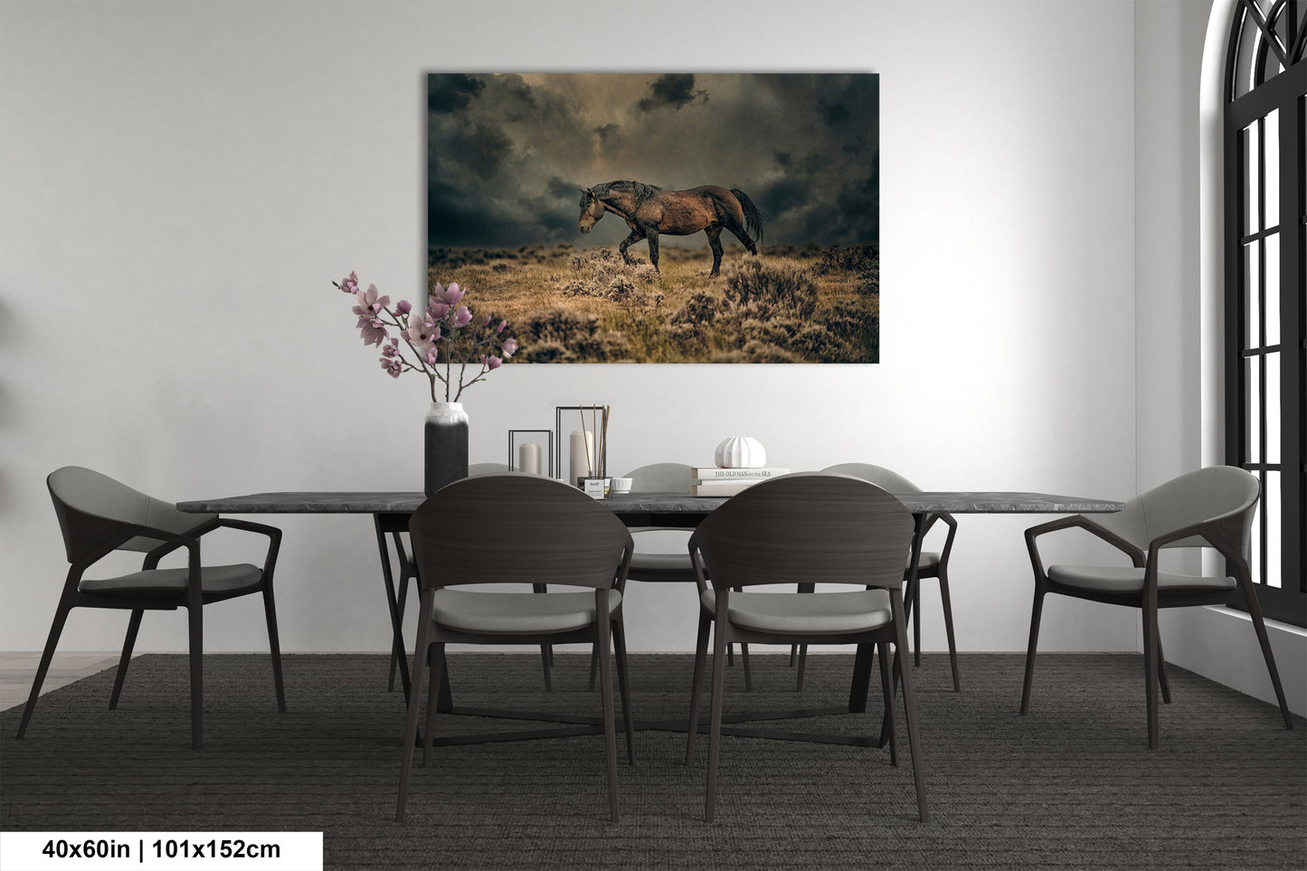 a dining room table with chairs and a painting of a horse on the wall