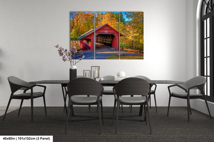 a painting of a covered bridge in autumn